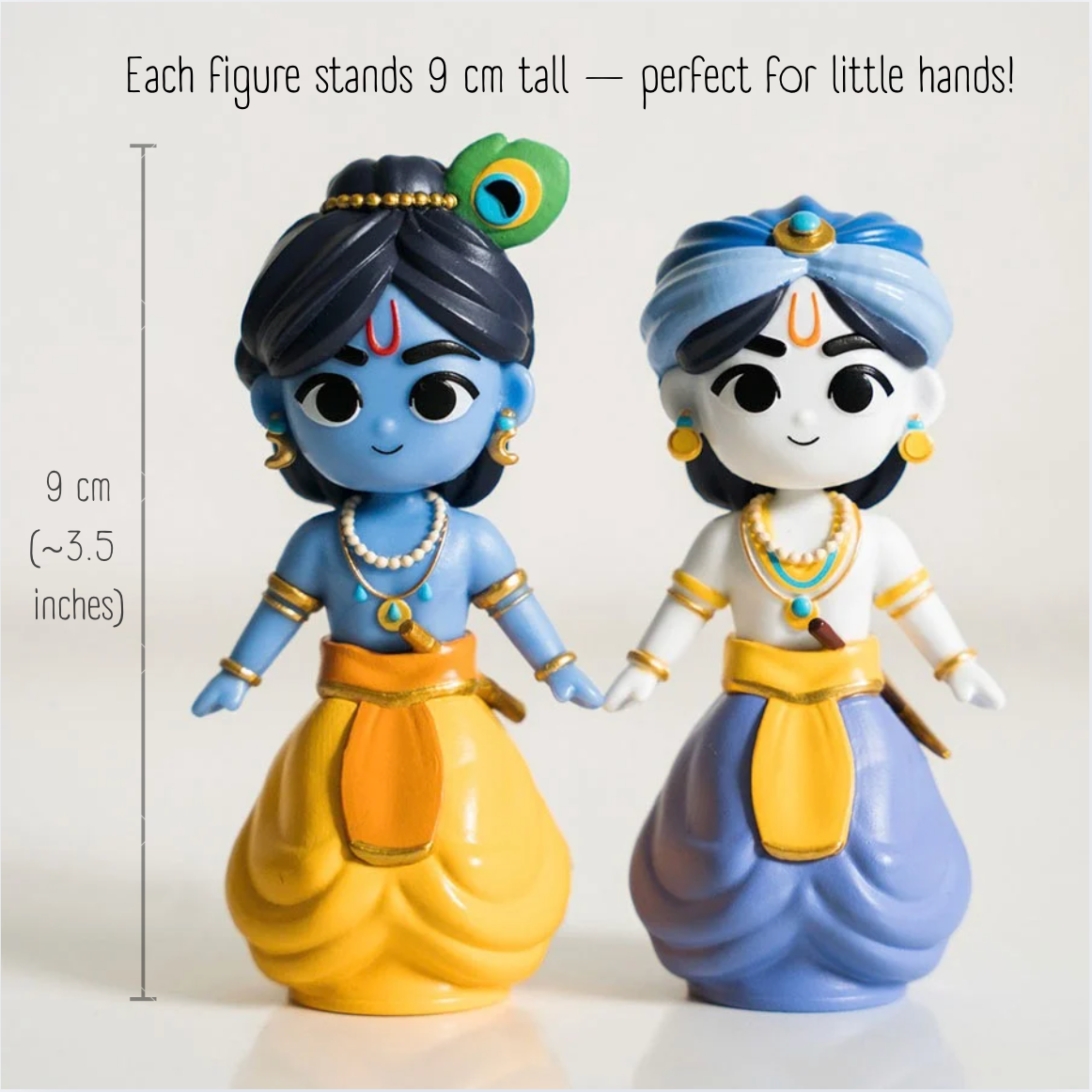 Krishna and Balarama figures next to a scale showing their height of 9 cm, about 3.5 inches